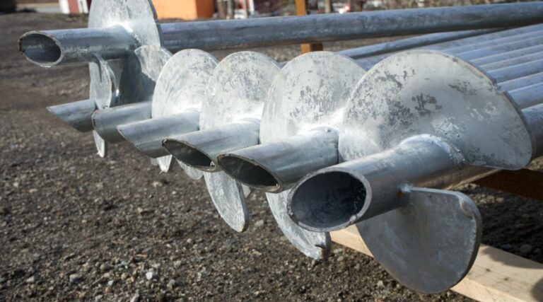Row of helical piles ready to install