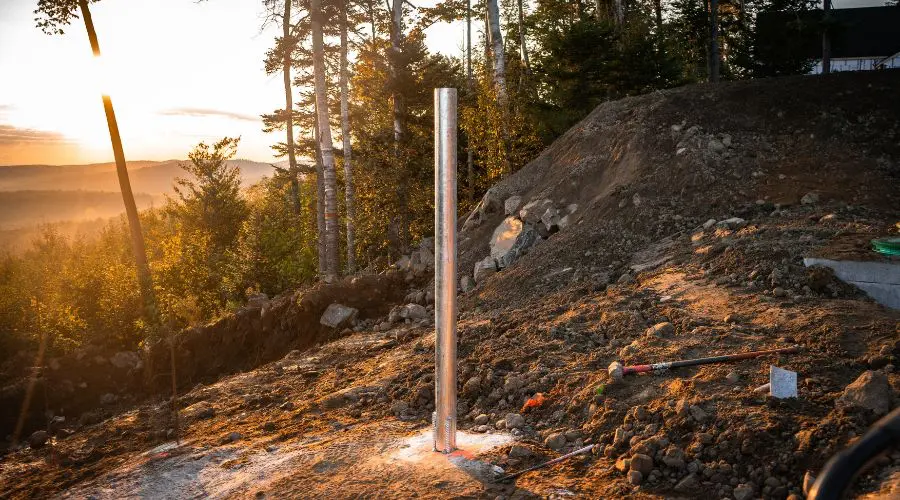A screw pile on a sloped terrain